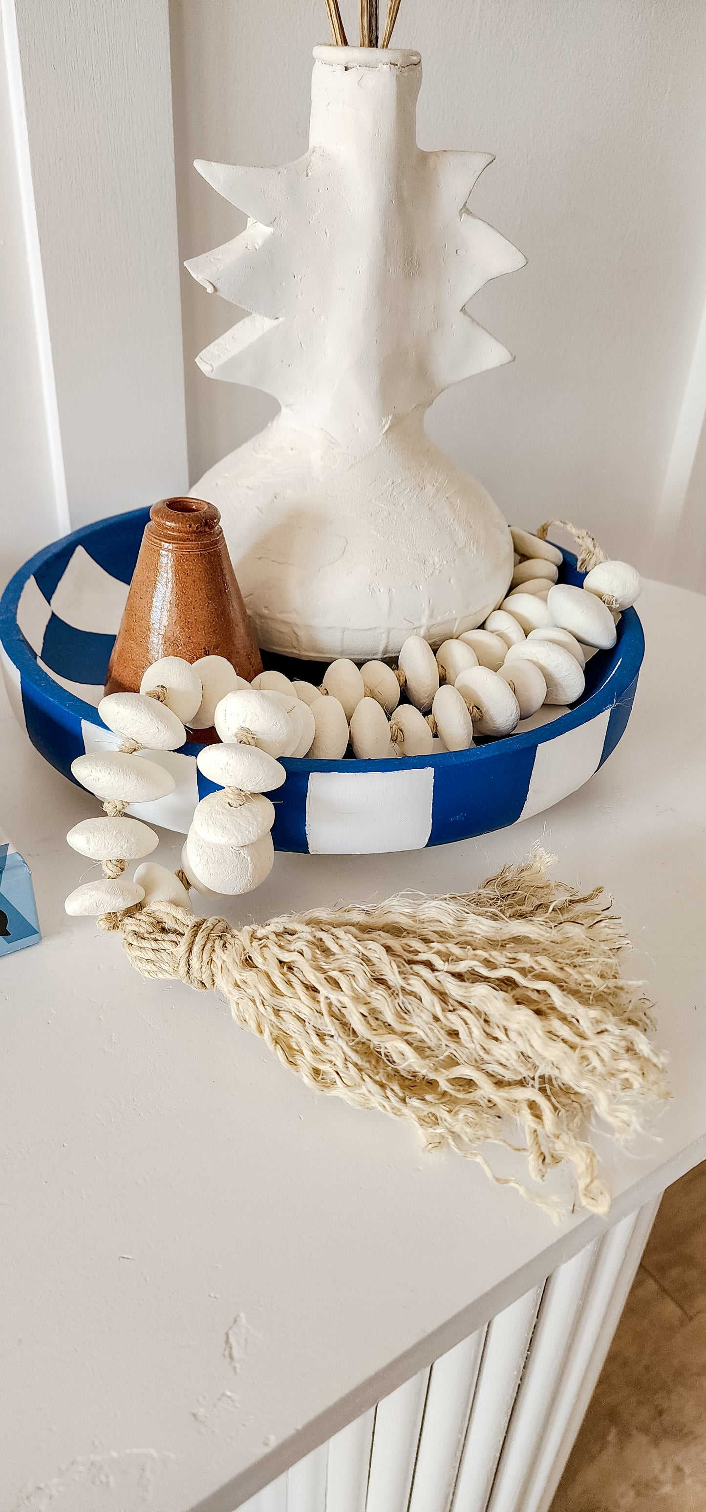 Clay beads with tassel.