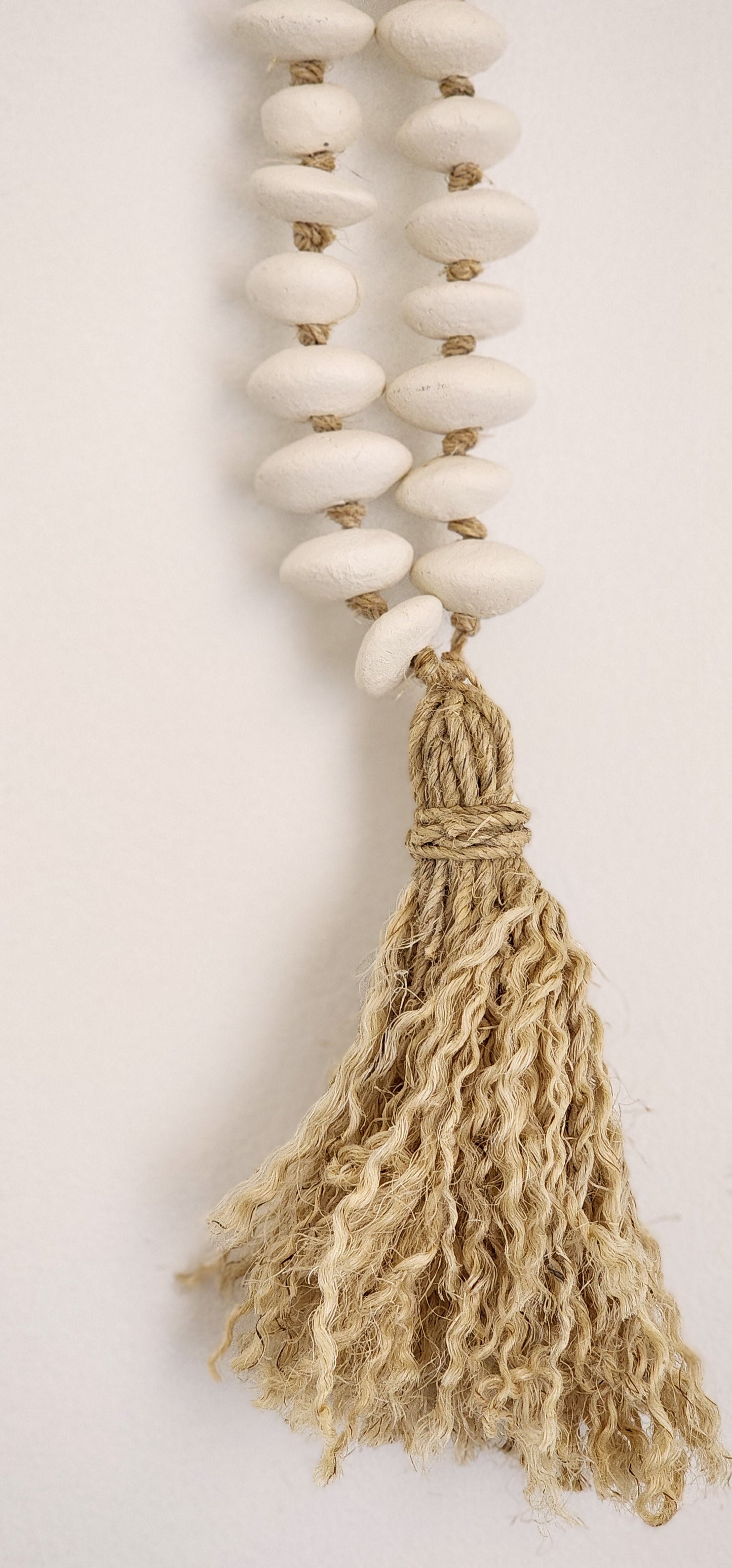 Clay beads with tassel.